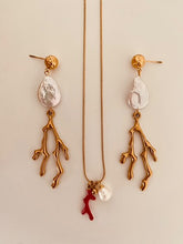 Load image into Gallery viewer, Elevate your summer style with these stunning handmade statement earrings, featuring a bold combination of a lustrous natural freshwater pearl and a striking coral drop. Crafted from gold-plated stainless steel for durability and shine, these lightweight yet eye-catching earrings blend elegance with a touch of coastal charm—perfect for any occasion.