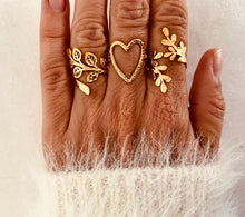 Load image into Gallery viewer, This stunning 18K gold-plated ring combines timeless elegance with a touch of nature-inspired charm. Crafted from durable stainless steel, its hammered texture creates a vintage metal finish that catches the light with every movement. The delicate leaf motif adds a unique, organic feel, while the adjustable design ensures a perfect fit for any finger. Waterproof and built to last, this ring is the ideal accessory for those who appreciate sophisticated, yet effortless style.