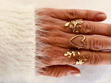 Load image into Gallery viewer, This stunning 18K gold-plated ring combines timeless elegance with a touch of nature-inspired charm. Crafted from durable stainless steel, its hammered texture creates a vintage metal finish that catches the light with every movement. The delicate leaf motif adds a unique, organic feel, while the adjustable design ensures a perfect fit for any finger. Waterproof and built to last, this ring is the ideal accessory for those who appreciate sophisticated, yet effortless style.