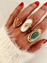 Load image into Gallery viewer, Fall in love with the effortless charm of this stainless steel hollow heart ring — a minimalistic statement piece with a romantic twist. Featuring a sleek open design and a delicate heart-shaped cutout, this ring blends Western-inspired style with modern simplicity. Available in both polished silver and radiant gold finishes, it's the perfect accessory for adding a subtle touch of elegance to your everyday look or party outfit. Durable, waterproof, and endlessly versatile, it also makes a thoughtful gift th