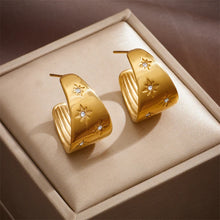 Load image into Gallery viewer, These unique earrings showcase an artistic blend of bohemian charm with a playful design, featuring a banana-shaped water drop element and diagonal circular accents, adorned with shimmering zircons. The intricate long eyelash details add texture and flair, making these earrings a true statement piece. Perfect for adding a touch of creativity and sparkle to any look, these earrings are ideal for those who love bold, eye-catching jewelry.