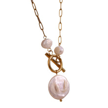 Load image into Gallery viewer, Introducing our elegant stainless steel gold necklace, a timeless piece that combines sophistication with modern design. Crafted from gold-tone stainless steel for durability and a lasting shine, this necklace features a chic toggle clasp adorned with two small natural freshwater pearls for a touch of refined elegance. At the bottom, a striking statement freshwater pearl adds a bold yet graceful focal point, making this necklace the perfect accessory for both special occasions and everyday luxury.