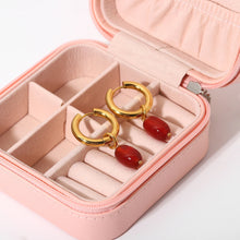 Load image into Gallery viewer, These high-quality hoop earrings combine tarnish-free stainless steel with stunning natural stones, featuring vibrant deep onyx crystals. The combination of these gemstones adds a rich, earthy elegance to the classic hoop design, creating a refined and versatile accessory for any occasion. Perfect for women who appreciate natural beauty and durability, these earrings offer a timeless charm that elevates any outfit with a touch of sophistication