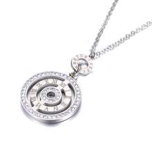 Load image into Gallery viewer, Add timeless elegance to your style with these titanium stainless steel geometric cubic zirconia crystal pedant necklace. Featuring a sleek design with sparkling cubic zirconia accents and classic Roman numeral detailing, this necklace is perfect for weddings, formal events, or elevating everyday looks. Crafted from durable titanium stainless steel, it offers lasting shine and sophistication. A stunning accessory that blends modern charm with classic beauty, making it an ideal gift or addition to your colle