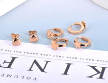 Load image into Gallery viewer, Add a touch of playful elegance to your look with these trendy titanium stainless steel star, heart, and flower charm earrings. This 3-pair set offers versatile designs perfect for any occasion, from casual wear to parties. Crafted for durability and style, these earrings are ideal for women and girls who love charming, eye-catching jewelry that adds a spark of fun to any outfit.