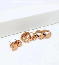 Load image into Gallery viewer, Add a touch of playful elegance to your look with these trendy titanium stainless steel star, heart, and flower charm earrings. This 3-pair set offers versatile designs perfect for any occasion, from casual wear to parties. Crafted for durability and style, these earrings are ideal for women and girls who love charming, eye-catching jewelry that adds a spark of fun to any outfit.
