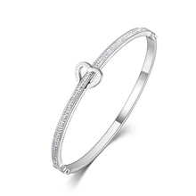 Load image into Gallery viewer, Celebrate timeless love with this stainless steel "Love Forever" rhinestone cuff bracelet. Elegantly designed with sparkling rhinestone accents and a sleek, durable finish, this bracelet exudes sophistication and romance. Perfect as a Valentine's Day gift or a meaningful accessory for everyday wear, it’s a beautiful reminder of everlasting affection. Durable and stylish, it’s a piece she’ll cherish forever.
