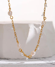 Load image into Gallery viewer, This romantic 18K gold plated stainless steel necklace comes in a gold colour. It is made as a combination of chain and natural freshwater pearls. The necklace is additionally adorned with little cubic zirconia that are attached to the chain. The necklace is perfect for spicing up your daily or evening outfit. It has lobster clasp and adjustable length.