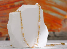Load image into Gallery viewer, This romantic 18K gold plated stainless steel necklace comes in a gold colour. It is made as a combination of chain and natural freshwater pearls. The necklace is additionally adorned with little cubic zirconia that are attached to the chain. The necklace is perfect for spicing up your daily or evening outfit. It has lobster clasp and adjustable length.