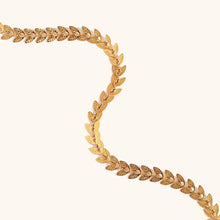 Load image into Gallery viewer, Elevate your style with this elegant leaves fishtail chain bracelet, crafted from gold-plated stainless steel for a timeless shine. Featuring a delicate leaf-inspired design, this bracelet adds a touch of nature-inspired elegance to any outfit. Durable and stylish, it’s perfect for both everyday wear and special occasions. A must-have addition to any jewelry collection or a thoughtful gift for someone special.