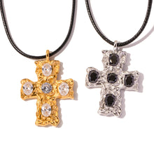 Load image into Gallery viewer, This glam rock necklace is made of stainless steel pendant which is hanging on a black wax rope. The beautiful cross pendant comes in two colours: gold and silver. It has irregular surface which is additionally adorned with 5 big cubic zirconia. It is a perfect piece for any daily occasion as well a great gift for your beloved friend. The necklace has lobster clasp and adjustable chain.