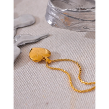 Load image into Gallery viewer, Show your love with this exquisite stainless steel heart love cubic zirconia pendant necklace. Featuring a dazzling heart-shaped cubic zirconia pendant in radiant gold color, this necklace exudes romance and sophistication. Crafted from high-quality stainless steel, it offers lasting shine and durability, making it perfect for everyday wear or special occasions. A timeless piece of jewelry that makes a thoughtful gift or a beautiful addition to your collection.