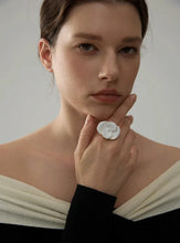 Load image into Gallery viewer, This exquisite adjustable ring showcases a delicate white enamel flower, set on durable, waterproof stainless steel for a chic yet enduring design. With its elegant floral detailing, this ring adds a refined, feminine touch to any outfit, embodying a timeless yet fashion-forward aesthetic. Perfect for daily wear or special occasions, it’s a versatile piece that complements any style.