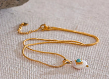 Load image into Gallery viewer, Add a touch of French elegance to your look with this stainless steel natural freshwater pearl necklace, featuring a delicate charm adorned with a turquoise stone at its center. Crafted with premium materials, this stylish piece is both waterproof and hypoallergenic, making it perfect for everyday wear without compromising on luxury. The natural freshwater pearl bring timeless beauty, while the turquoise stone adds a pop of color and a unique flair.