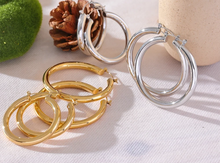 Load image into Gallery viewer, Elevate your style with these minimalistic big hollow hoop earrings, crafted from anti-allergic 316L stainless steel for lasting comfort and durability. Their sleek, round design offers a modern and trendy touch, perfect for adding effortless elegance to any outfit. Lightweight and versatile, these simple yet bold earrings are a must-have accessory for everyday wear or special occasions.