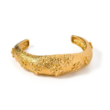 Load image into Gallery viewer, Make a bold statement with this designer 18K gold-plated bangle, featuring a stunning textured flower design. Crafted from high-quality stainless steel for lasting shine, this eye-catching piece exudes elegance and charm. Perfect for stacking or wearing solo, it’s a statement accessory and a beautiful gift for any special occasion!