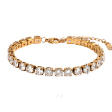 Load image into Gallery viewer, Elevate your style with this luxurious gold plated tennis bracelet, featuring dazzling AAA-grade zircon stones for a radiant sparkle. Crafted from durable stainless steel, this trendy bracelet combines elegance and durability, making it perfect for everyday wear or special occasions. A timeless accessory that adds a touch of sophistication to any outfit, it’s a must-have for any jewelry collection or a thoughtful gift for someone special.