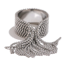 Load image into Gallery viewer, Make a bold statement with this stainless steel chain tassel finger ring, featuring an eye-catching adjustable design in both gold and silver 18K plated finishes. Crafted from high-quality stainless steel, this stylish ring combines elegance with modern charm. The delicate chain tassel detail adds a unique touch, making it a perfect accessory for any fashion-forward jewelry lover. Ideal for both casual and special occasions!