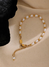 Load image into Gallery viewer, Embrace timeless elegance with this stunning natural freshwater pearl and stainless steel bead bracelet. Expertly handcrafted, this bracelet alternates lustrous freshwater pearls with polished stainless steel beads, creating a harmonious blend of classic and contemporary style. Finished with waterproof PVD coating, this durable piece is designed for everyday wear while maintaining its exquisite beauty.
