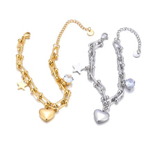 Load image into Gallery viewer, Add a touch of elegance and charm to your look with this stainless steel cubic zirconia crystal charm bracelet. Plated in radiant 18K gold, this delicate chain bracelet features a trio of enchanting charms—a sparkling zircon, a shining star, and a timeless heart. Perfect for everyday wear or special occasions, this bracelet combines durability and style, making it a versatile addition to any jewelry collection or a thoughtful gift for someone special.