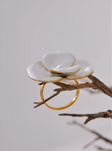 Load image into Gallery viewer, This exquisite adjustable ring showcases a delicate white enamel flower, set on durable, waterproof stainless steel for a chic yet enduring design. With its elegant floral detailing, this ring adds a refined, feminine touch to any outfit, embodying a timeless yet fashion-forward aesthetic. Perfect for daily wear or special occasions, it’s a versatile piece that complements any style.