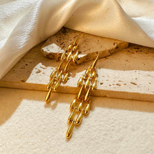 Load image into Gallery viewer, These creative teardrop earrings feature an intricate mesh design, plated in gold for a luxurious yet lightweight look. Crafted from high-quality stainless steel, they include delicate long tassels that add movement and elegance, making them a standout accessory for any occasion. Perfect for those who love stylish, eye-catching jewelry, these earrings offer a chic blend of modern flair and timeless charm, ideal for effortlessly enhancing any outfit.
