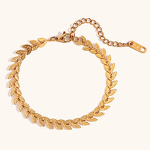 Load image into Gallery viewer, Elevate your style with this elegant leaves fishtail chain bracelet, crafted from gold-plated stainless steel for a timeless shine. Featuring a delicate leaf-inspired design, this bracelet adds a touch of nature-inspired elegance to any outfit. Durable and stylish, it’s perfect for both everyday wear and special occasions. A must-have addition to any jewelry collection or a thoughtful gift for someone special.