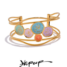 Load image into Gallery viewer, Make a bold statement with our gold-plated stainless steel colorful enamel open angle, designed for fashionable women who love eye-catching accessories. This stylish bangle features an exaggerated, large design adorned with five vibrant enamel circles in red, purple, turquoise, green, and pink, adding a playful splash of color to any outfit. Perfect for making a statement at any occasion, this chic and modern bracelet is a must-have for those who want to stand out with elegance and creativity.