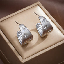 Load image into Gallery viewer, These unique earrings showcase an artistic blend of bohemian charm with a playful design, featuring a banana-shaped water drop element and diagonal circular accents, adorned with shimmering zircons. The intricate long eyelash details add texture and flair, making these earrings a true statement piece. Perfect for adding a touch of creativity and sparkle to any look, these earrings are ideal for those who love bold, eye-catching jewelry.