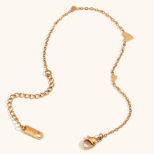 Load image into Gallery viewer, Embrace timeless elegance with this minimalist three heart O-Chain bracelet, crafted from premium stainless steel for a sleek and durable finish. Featuring a delicate chain adorned with three romantic heart charms, this bracelet adds a touch of luxury and femininity to any look. Perfect for everyday wear or special occasions, it’s a versatile and stylish accessory for any modern woman.