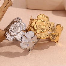 Load image into Gallery viewer, Make a statement with this elegant wide cuff bracelet, featuring beautifully exaggerated floral details for a bold yet sophisticated look. Crafted from premium stainless steel, it’s durable, stylish, and designed for all-day comfort. Perfect for adding a touch of elegance to any outfit, this stunning piece is a must-have for any jewelry collection!