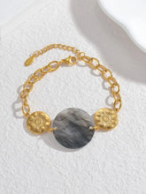 Load image into Gallery viewer, Embrace effortless elegance with this stylish bracelet, featuring a radiant sun pendant paired with a shell disc in your choice of white or black. Crafted from 18K gold-plated stainless steel, this waterproof piece is both durable and chic, making it perfect for daily wear or special occasions. A timeless accessory and a thoughtful gift for any jewelry lover.
