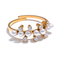 Load image into Gallery viewer, Enhance your elegance with this delicate adjustable golden ring, featuring luminous imitation pearls and sparkling zirconia accents. Crafted from durable stainless steel, this stylish ring offers a timeless design perfect for daily wear or special occasions. Its adjustable fit ensures comfort, making it a versatile and thoughtful gift for any woman who loves refined, feminine jewelry.