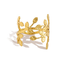 Load image into Gallery viewer, Add a touch of nature’s elegance to your look with this exquisite stainless steel metal plants ring. Featuring a beautifully irregular texture and 18K gold plating, this ring combines organic, leaf-inspired design with a modern, luxurious twist. The intricate metalwork captures the beauty of nature while remaining trendy and wearable for any occasion. Waterproof and crafted for durability, this statement piece is perfect for those who appreciate bold style with a timeless, sophisticated charm. A must-have f