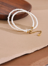 Load image into Gallery viewer, Elevate your everyday elegance with this handmade beaded necklace, featuring non-peeling imitation pearls and a durable stainless steel chain. Designed for both style and longevity, this lightweight and versatile piece adds a touch of sophistication to any outfit. Whether for casual wear or a special occasion, its timeless charm makes it a must-have accessory for any jewelry collection.