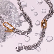 Load image into Gallery viewer, Make a bold statement with this cool 8mm thick stitching O-chain necklace, featuring a stunning silver color with a contrasting gold paperclip buckle for a modern edge. Crafted from premium stainless steel, this durable and sleek piece adds a touch of sophistication to any outfit. Perfect for layering or wearing solo, it's a versatile accessory for both casual and dressy occasions. A must-have addition to any jewelry collection!