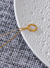 Load image into Gallery viewer, Add a touch of elegance to your look with this chic luxury round pendant necklace. Featuring a natural shell accented with a sparkling zircons and carved bee, this graceful design exudes French-inspired charm. Crafted from durable stainless steel, it’s waterproof and perfect for everyday wear or special occasions. A sophisticated accessory that blends style and durability, making it a timeless addition to any jewelry collection.