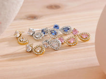 Load image into Gallery viewer, Add a touch of elegance with these shiny cubic zirconia water drop dangle earrings. Crafted from durable stainless steel, these exquisite earrings feature sparkling cubic zirconia in a delicate drop design, perfect for any occasion. Lightweight and stylish, they offer a timeless charm that complements both casual and formal looks. A must-have accessory or a thoughtful gift for someone special!
