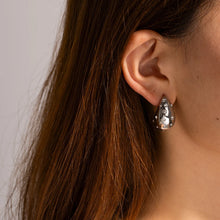 Load image into Gallery viewer, These chic chubby waterdrop stud earrings bring a touch of elegance with their sleek gold and silver color options and embedded zircon accents that add a hint of sparkle. Crafted from durable stainless steel, they’re designed to be both stylish and long-lasting, making them a versatile accessory for any occasion.
