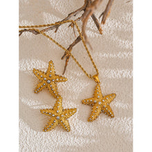 Load image into Gallery viewer, These stunning stud earrings, crafted from stainless steel, feature striking starfish pendants that exude summer elegance. Each starfish is beautifully adorned with sparkling cubic zirconia, adding a radiant touch of glamour and sophistication to your look. Perfect for complementing any summer outfit, these earrings effortlessly bring a hint of coastal charm and eye-catching sparkle.