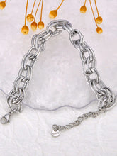 Load image into Gallery viewer, Make a bold statement with this oval circle handmade chain bracelet, meticulously crafted with alternating notched links for added texture and style. Plated in luxurious 18K gold, this stunning piece exudes sophistication and elegance, while the stainless steel construction ensures it remains waterproof and tarnish-free for lasting beauty. Perfect for any occasion, this eye-catching bracelet offers both durability and fashion-forward design, making it a versatile accessory for daily wear or special events.