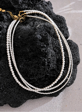 Load image into Gallery viewer, Elevate your everyday elegance with this handmade beaded necklace, featuring non-peeling imitation pearls and a durable stainless steel chain. Designed for both style and longevity, this lightweight and versatile piece adds a touch of sophistication to any outfit. Whether for casual wear or a special occasion, its timeless charm makes it a must-have accessory for any jewelry collection.