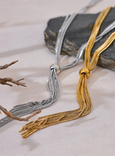 Load image into Gallery viewer, Elevate your style with this popular stainless steel long tassel necklace, featuring an 18K PVD gold plating for a luxurious finish. Its sleek, sweater chain design adds a trendy yet timeless touch to any outfit, making it perfect for layering or wearing alone. Durable and stylish, this personalized fashion piece is ideal for everyday wear or as a thoughtful gift for someone special.