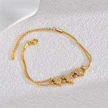 Load image into Gallery viewer, Add a touch of elegance to your look with this luxurious bracelet, featuring a heart shaped pendants inlaid with shimmering zircons. Crafted from gold-plated stainless steel, it offers both durability and timeless charm. Perfect for weddings, special occasions, or everyday sophistication, this exquisite piece makes a thoughtful and stylish gift for any woman.