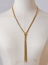 Load image into Gallery viewer, Elevate your style with this popular stainless steel long tassel necklace, featuring an 18K PVD gold plating for a luxurious finish. Its sleek, sweater chain design adds a trendy yet timeless touch to any outfit, making it perfect for layering or wearing alone. Durable and stylish, this personalized fashion piece is ideal for everyday wear or as a thoughtful gift for someone special.