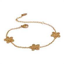 Load image into Gallery viewer, This delicate and classy bracelet is made out of stainless steel with 18K gold plating. It consists of a thin chain with three flower charms and it comes in gold colour. It has a size adjustable lobster clasp. It can be worn as a perfect summer accessory.