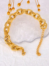Load image into Gallery viewer, Make a bold statement with this oval circle handmade chain bracelet, meticulously crafted with alternating notched links for added texture and style. Plated in luxurious 18K gold, this stunning piece exudes sophistication and elegance, while the stainless steel construction ensures it remains waterproof and tarnish-free for lasting beauty. Perfect for any occasion, this eye-catching bracelet offers both durability and fashion-forward design, making it a versatile accessory for daily wear or special events.