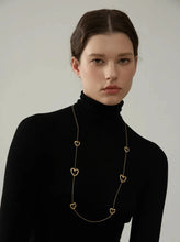 Load image into Gallery viewer, Add a touch of romance to your look with this stunning 85cm stainless steel heart contour charm necklace, available in both silver and gold finishes. Elegantly designed, this long chest chain features delicate heart-shaped charms spread along the length of the chain, creating a subtle yet captivating statement of love. Crafted from durable, waterproof stainless steel, this piece ensures lasting shine and beauty, making it perfect for both everyday wear and special occasions.