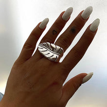 Load image into Gallery viewer, Make a bold statement with this leaf ring, a stylish and creative accessory designed for the modern woman. Made from rust-proof stainless steel, this elegant ring features a delicate leaf motif that exudes natural charm. Available in both silver and gold finishes, it offers versatility to match any outfit. Its sleek, waterproof design ensures long-lasting wear, making it the perfect accessory for any occasion.