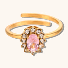 Load image into Gallery viewer, Add a touch of elegance to your look with this luxurious gold plated flower oval zircon ring. Crafted from durable stainless steel, this stunning piece features a sparkling oval zircon centerpiece surrounded by delicate floral details. Perfect for parties or special occasions, it exudes sophistication and charm, making it a must-have accessory for any woman’s jewelry collection.